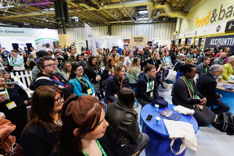 A large crowd of attendees gathered at the FAB UK show, engaging with various displays and activities.